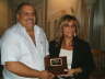 Patrice recieving Chamber Membership Plaque