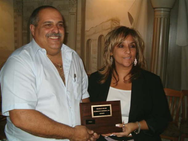 Patrice recieving Chamber Membership Plaque